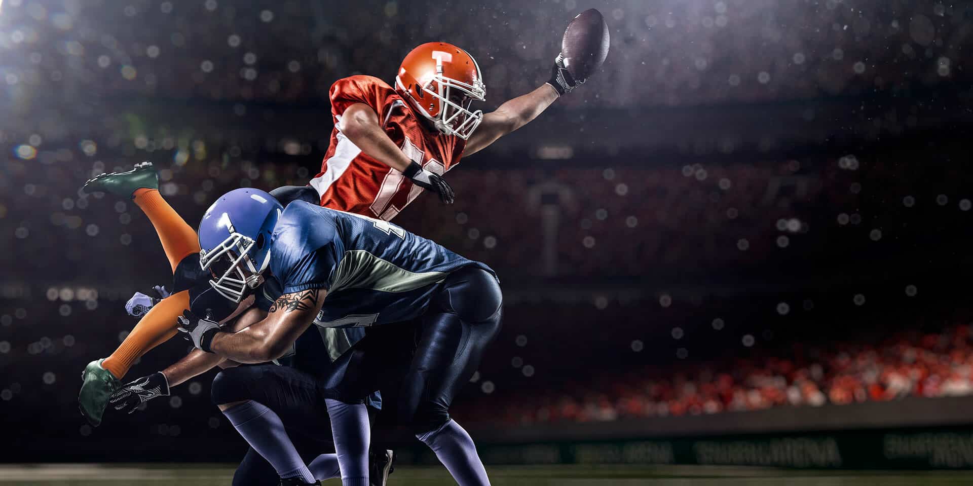 A football player seeks the assistance of a sports medicine specialist to improve his catching skills.