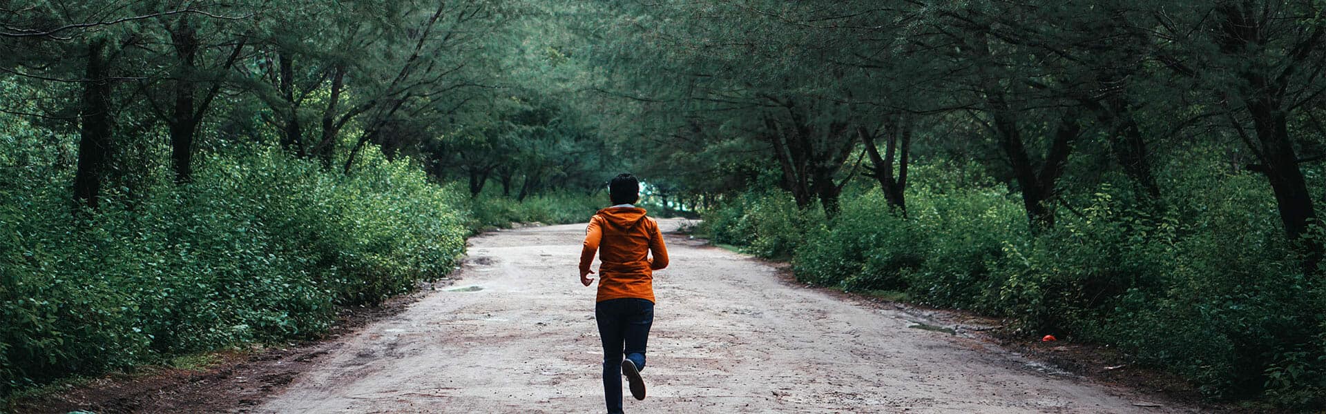 A cyclist on a dirt road seeking treatment from an orthopedist at a sports clinic.